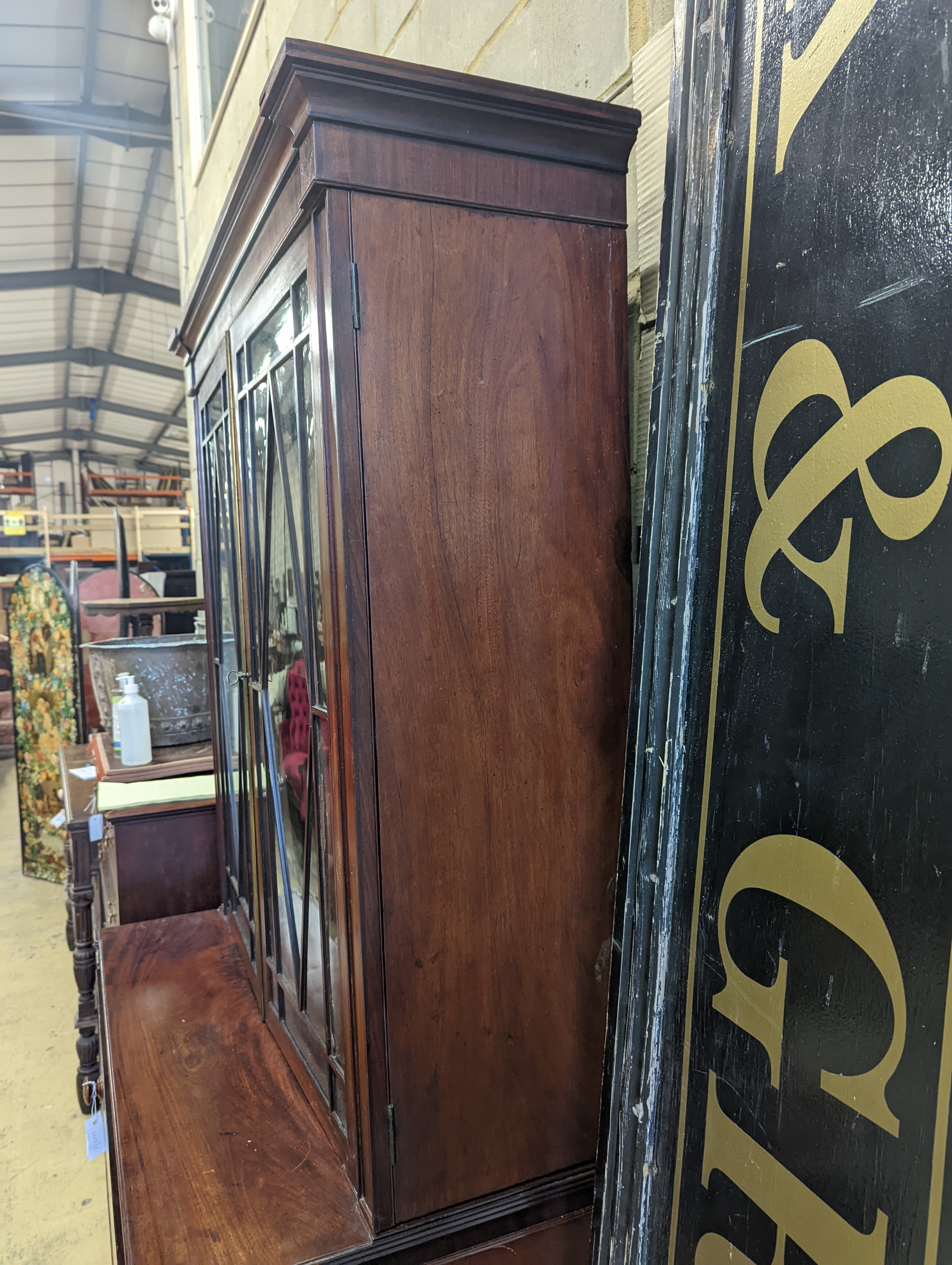 A Regency mahogany secretaire bookcase on lion paws feet, length 100cm, depth 56cm, height 216cm